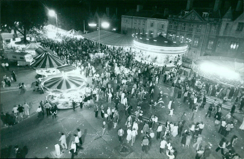 People gather at St. Giles Fair in Oxford, England, in the 1990s. - Vintage Photograph