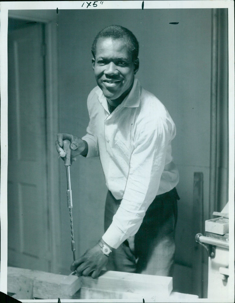 Mac McFarlane, a joiner, helps to make furniture for a new home at the Oxfordshire Rehabilitation Community Centre. - Vintage Photograph