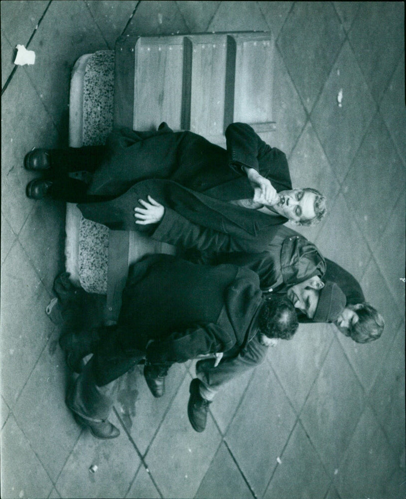 Men resting on benches in the Westgate Centre. - Vintage Photograph