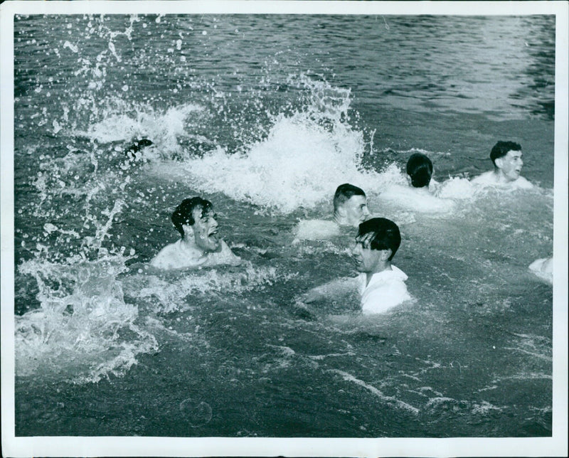 Reynolds and Bate smile after successfully throwing in the cox. - Vintage Photograph