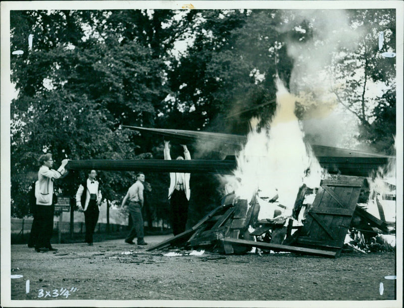 Christ Church undergraduates celebrating success in the Eights by burning boats on a bonfire. - Vintage Photograph