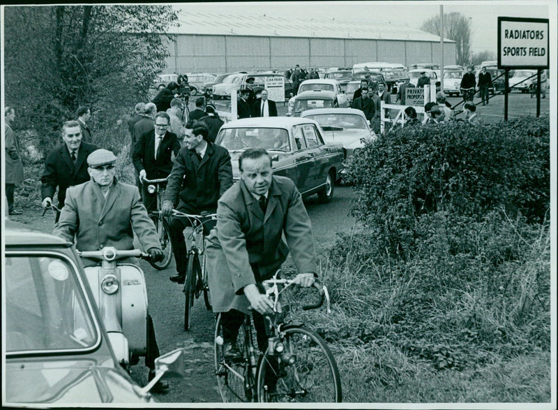 Employees leaving the factory after a meeting at Hoxx Holding. - Vintage Photograph