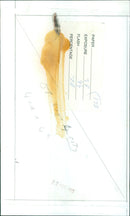 A paper is exposed to light in a darkroom. - Vintage Photograph