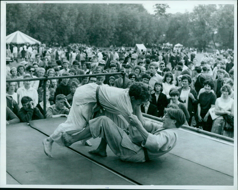 Judoka Sai Francis Glasborough Bruce Merry demonstrating judo throws before a large crowd. - Vintage Photograph