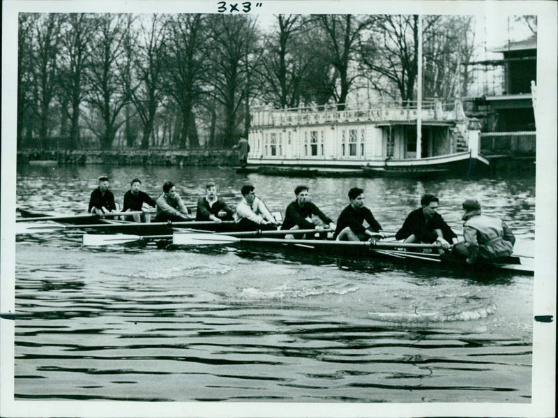 A rower from Pembroke College at the University of Oxford training on the Isis River ahead of the Torpids Boat Race. - Vintage Photograph