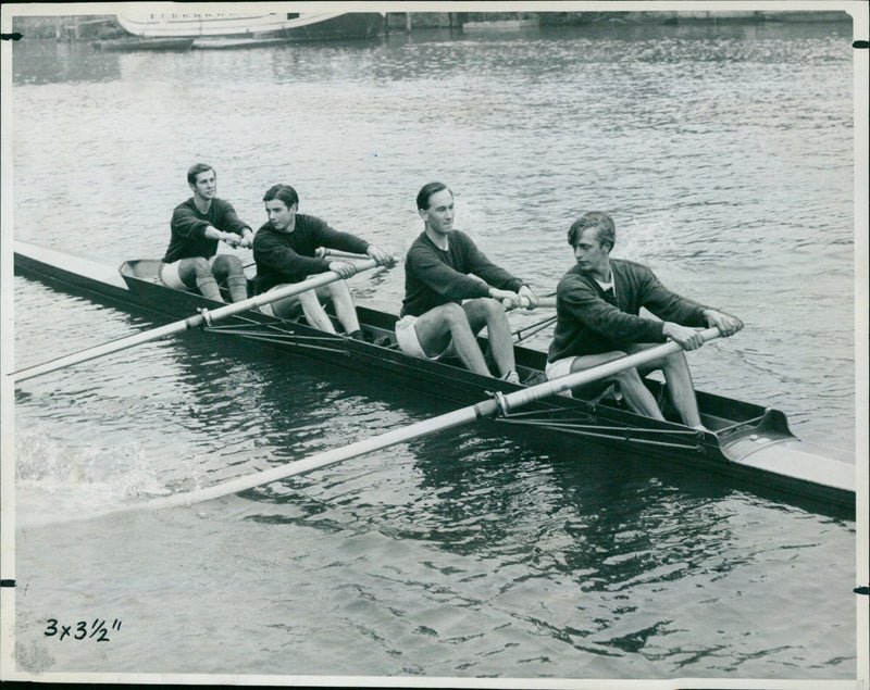 Oxford University's Keble College four-man rowing crew practices on the Isis river ahead of a coxswainless fours race. - Vintage Photograph