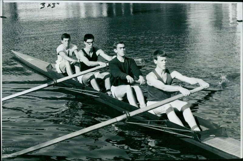 Balliol College rowers make an early start on the Isis in Oxford, England, on October 14, 1964. - Vintage Photograph