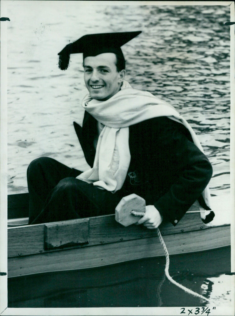 Carl Grossman, cox of St. John's College Schools VIII, wearing a mortar board. - Vintage Photograph