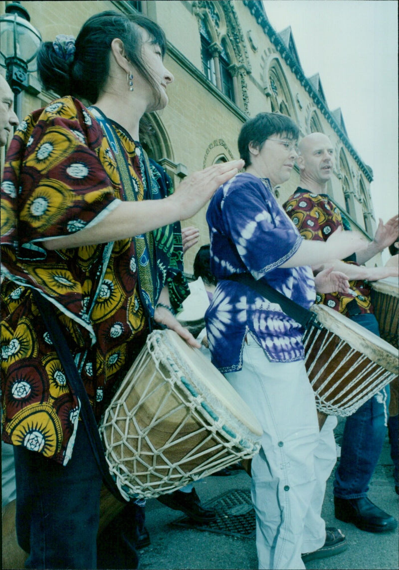 Musicians perform at the Pit Rivers Museum in Oxford, England. - Vintage Photograph