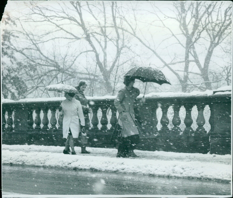 Pedestrians braving the snow on Magdalen Bridge in Oxford, UK. - Vintage Photograph