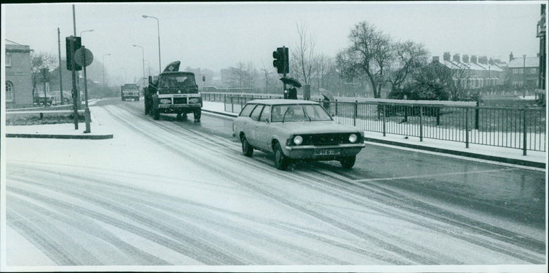 A police officer braves the snow in Thames Street. - Vintage Photograph