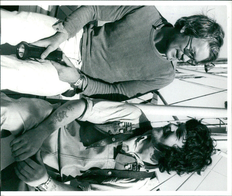 After nine hours in the water, Per Erik Froden was rescued by an angel boat after his trawler capsized off the coast of Simrishamn, Sweden. Photo by Stieg Eldh. - Vintage Photograph