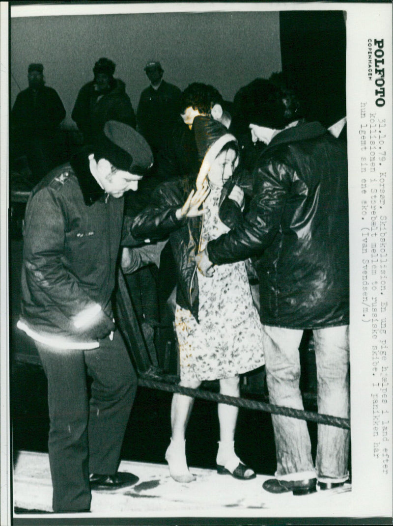 After a collision between two Russian vessels in the Great Belt, a young girl is assisted ashore in panic, having lost one of her shoes. - Vintage Photograph