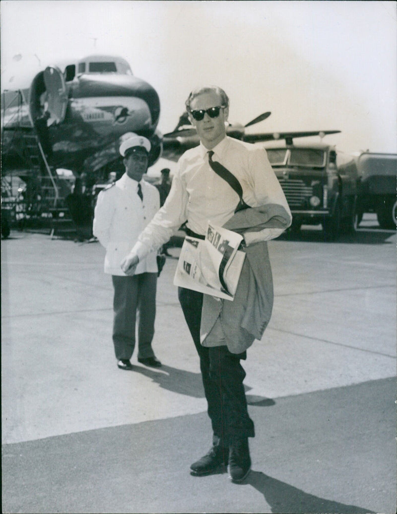 British pianist Robin Douglas Home arrives at Ciampino Airport in Rome, Italy on August 23rd, 1958. Home was previously the fiancé of Princess Margareta of Sweden. - Vintage Photograph