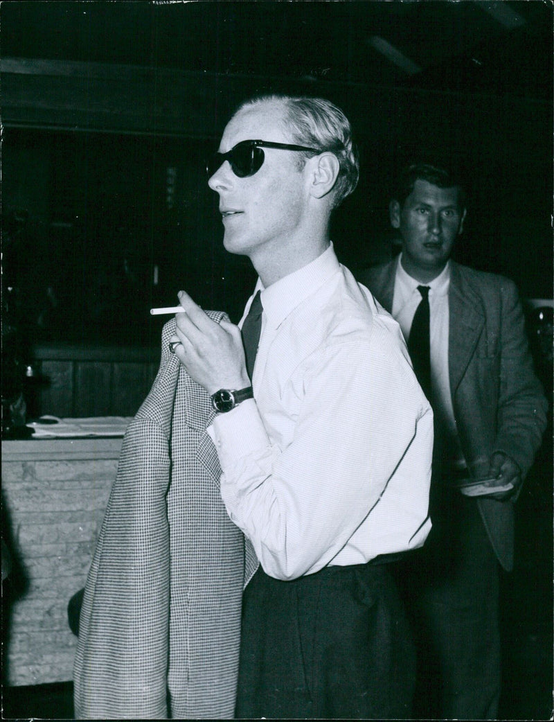 Musician Robin Douglas Home arrives at Ciampino Airport in Rome on route to South Africa, formerly the fiancée of Princess Margaretha of Sweden. - Vintage Photograph