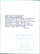 Mrs. Mamie Eisenhower, wife of President Dwight Eisenhower, inspects "President Eisenhower" roses at a flower show in Washington. - Vintage Photograph