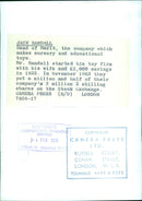 Jack Randall, the head of Merit, a company that produces nursery and educational toys, poses with a selection of his products in Stockholm, Sweden, on February 4, 1964. - Vintage Photograph