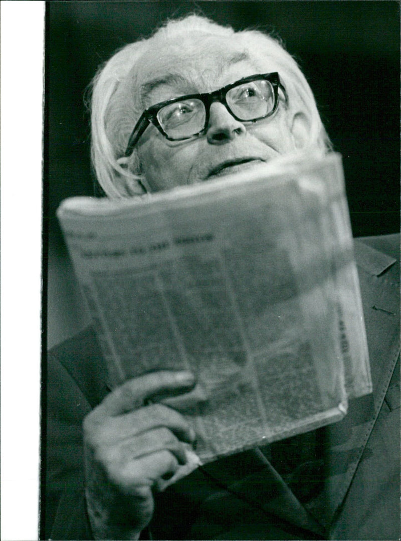 British Labour MP Michael Foot holds a copy of The Times newspaper at a political rally in Wales. - Vintage Photograph