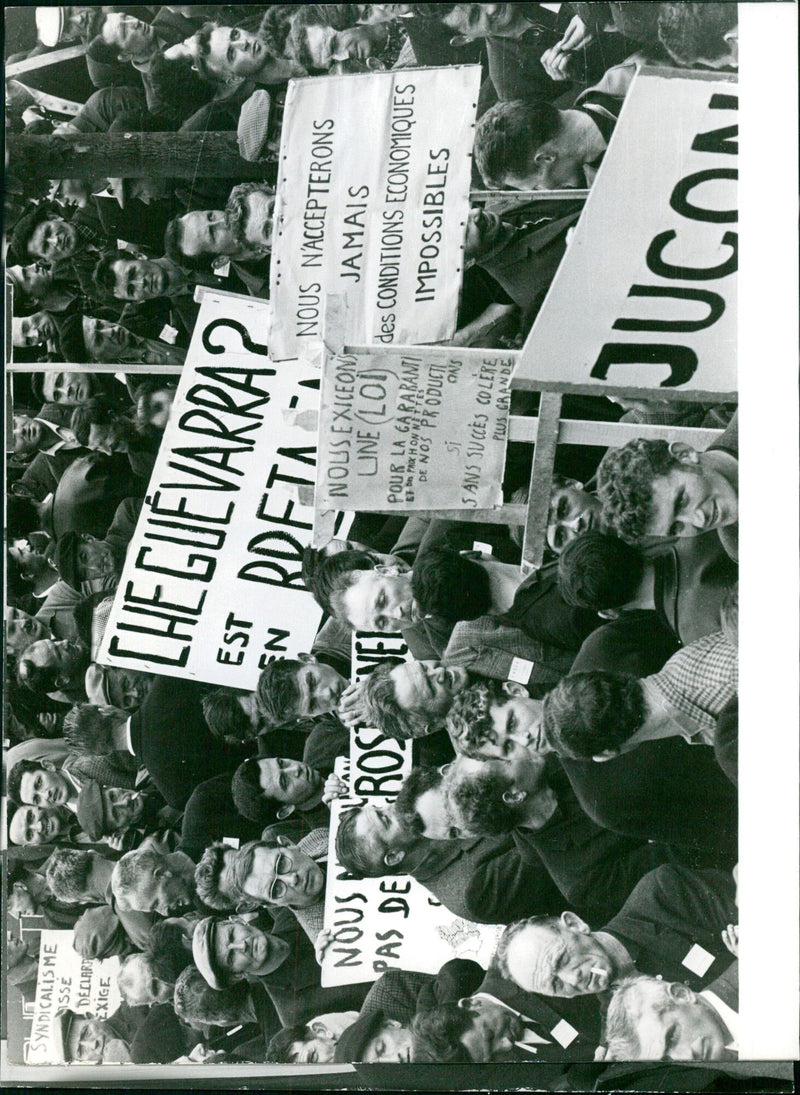 Workers of the Asse in Bretagne, France, protest against the conditions imposed by the government of Che Guevara. They demand better wages and prices for their products, and express their frustration with their lack of success. - Vintage Photograph