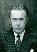 British businessmen Sir Hugh Fraser (l) and (r) attend the annual general meeting of Scottish & Universal Investments in London, England, in October 1976. - Vintage Photograph