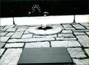On the 56th anniversary of his assassination, the tomb of President John F. Kennedy at Arlington Cemetery in Washington is remembered. - Vintage Photograph