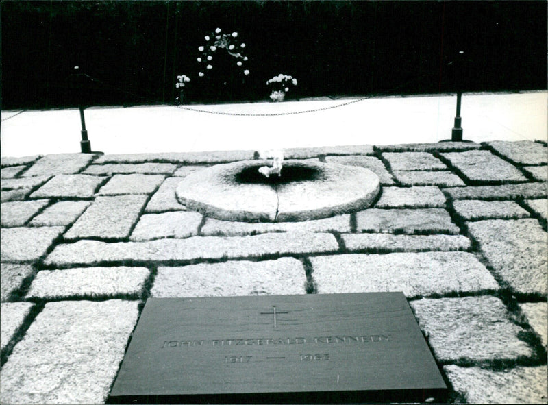 On the 56th anniversary of his assassination, the tomb of President John F. Kennedy at Arlington Cemetery in Washington is remembered. - Vintage Photograph