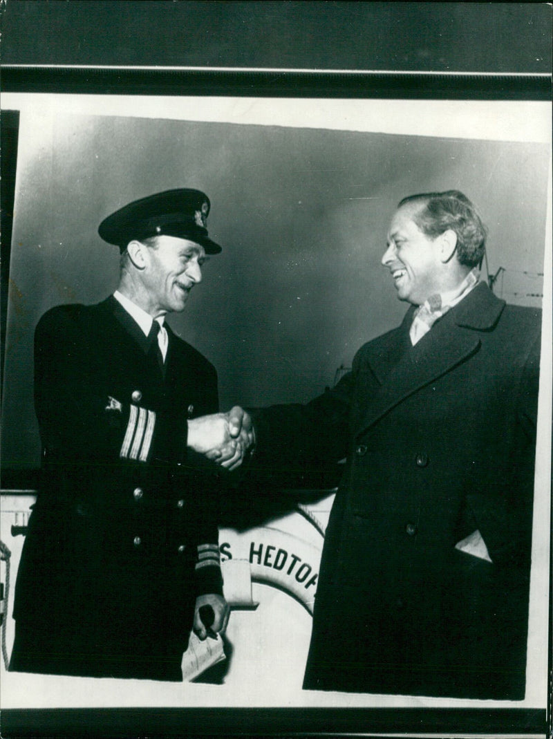 Captain P.L. Rasmussen bids farewell to Rederichefen Hans C. Christiansen from the MV Hans Hedtoft before its fateful voyage in 1959. - Vintage Photograph