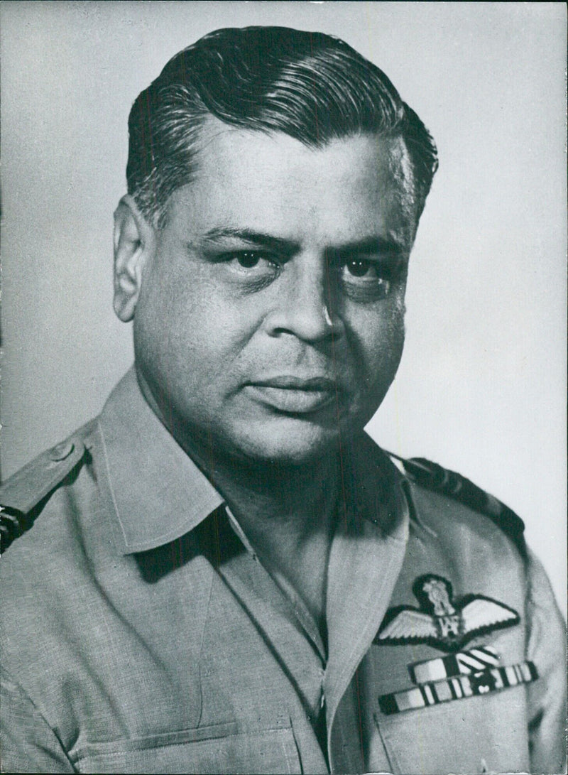 Air Vice-Marshal Rajaram, Air Officer Commander in Chief of the Western Air Command of the Indian Air Force, is pictured during a meeting with fellow service chiefs in MECHI, India. - Vintage Photograph