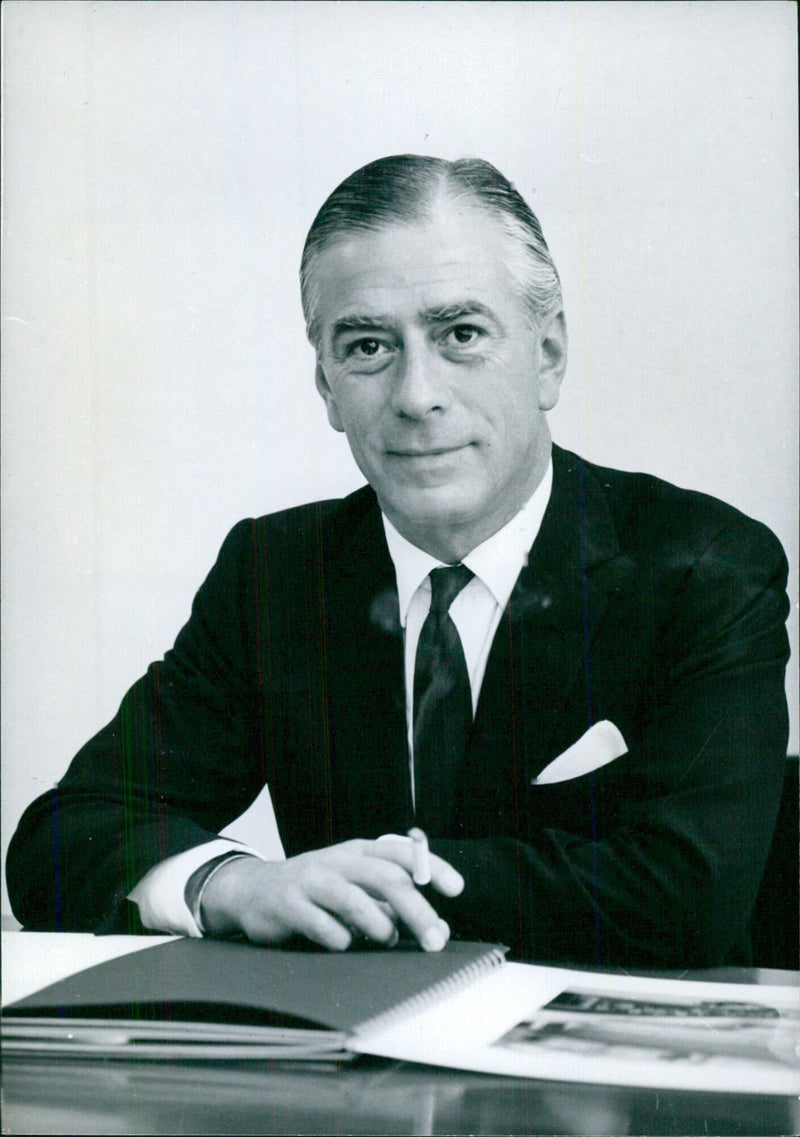 British businessman Max Rayne, Chairman of London Merchant Securities since 1960, poses for a portrait in 1966. - Vintage Photograph