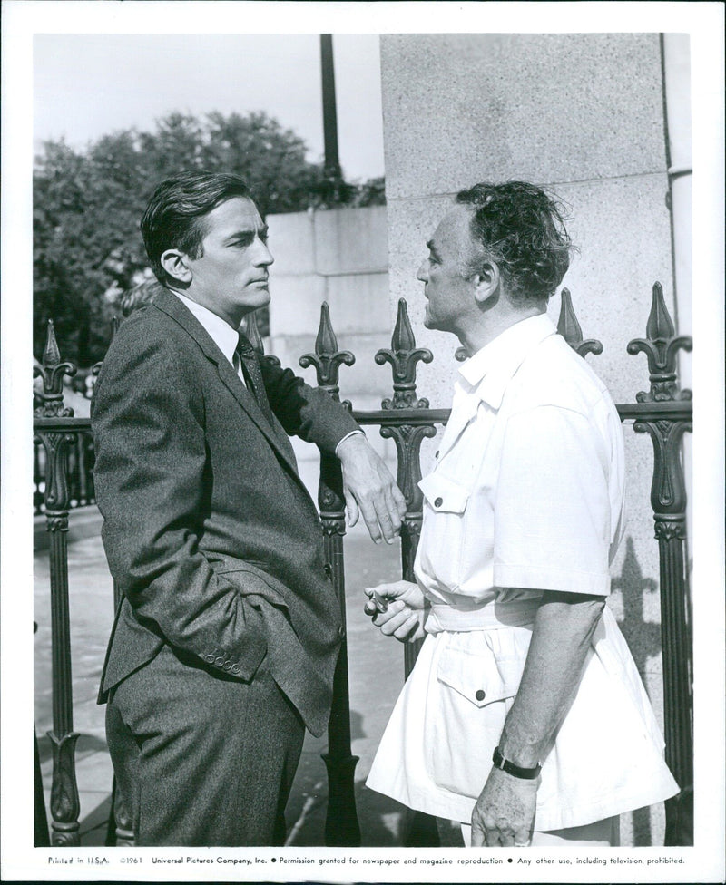 Actor Gregory Peck and Prodlnen Sy on the set of the 1961 Universal Pictures film "Cape Sy Bartlett". - Vintage Photograph