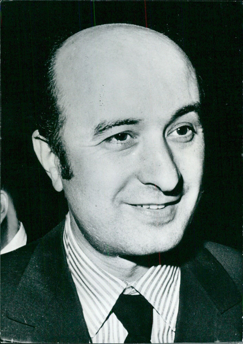 Italian Minister of Industry and Commerce, Ciriaco De Mita, attends a meeting of the Christian Democrats in 1974. - Vintage Photograph