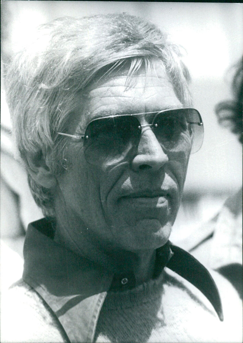 American film star James Coburn poses for a portrait in 1977. - Vintage Photograph