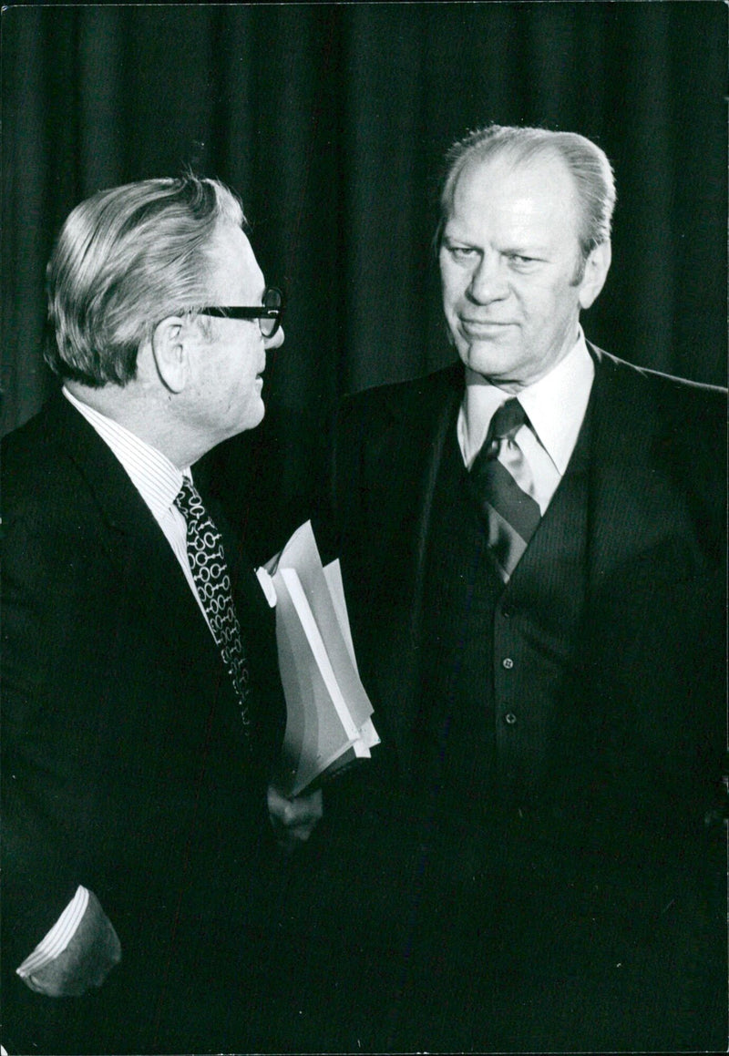 President Gerald Ford and Vice-President Nelson D. Rockefeller meet for a consultation in 1976. Photographer: James Pickrell, Camera Press London. - Vintage Photograph