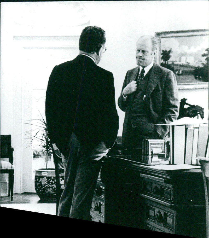 President Gerald Ford and Secretary of State Dr. Henry Kissinger share a moment of seriousness in the Oval Office of the White House in 1975. Photo by David Hume Kennerly/Camera Press/A&A Dildarkiv. - Vintage Photograph