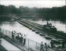 U.S. troops bridge the Seine near Paris, as French residents cheer the Allied advance in WWII. - Vintage Photograph