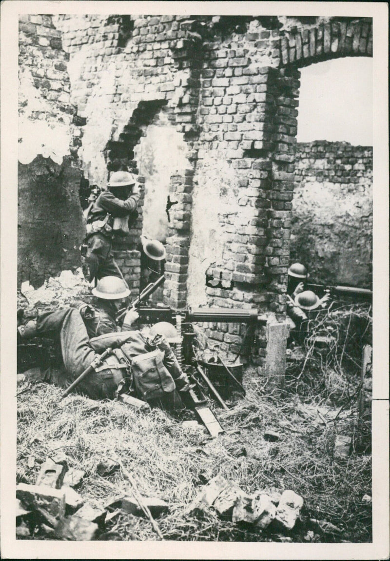 British machine gunners in a derelict house take up positions in support of allied forces. - Vintage Photograph