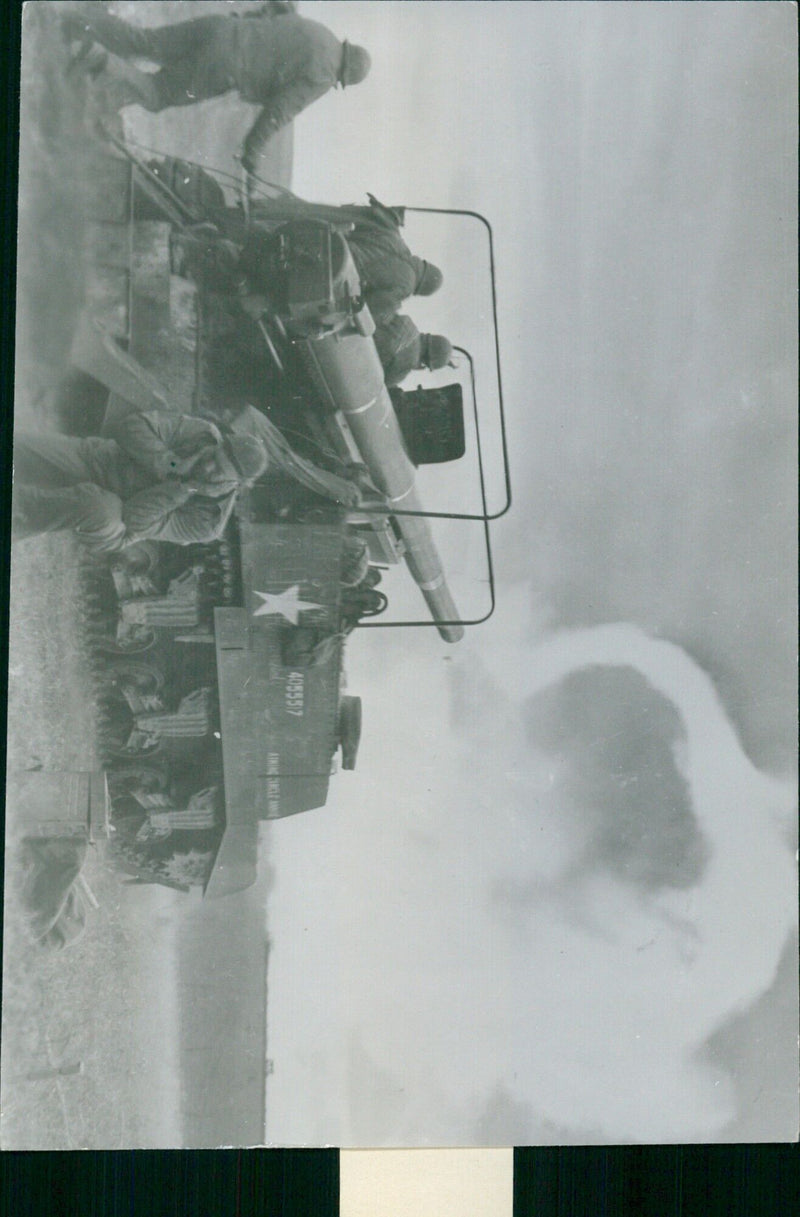 U.S. forces fire a 43 kg. shell from a 155 mm. Long Tom artillery piece across the Mosello River into Germany during World War II. - Vintage Photograph