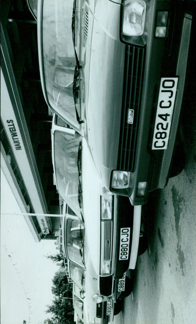 A car dealership in Hartwells Austin, England, has experienced an annual registration issue. - Vintage Photograph