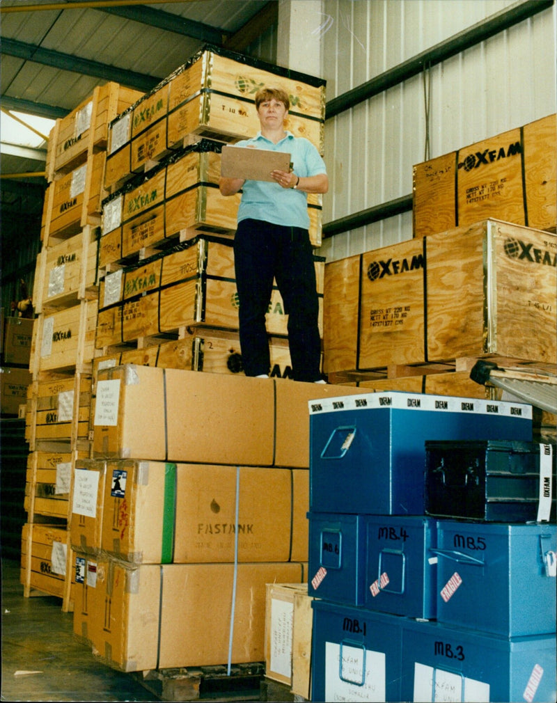 Relief supplies are loaded for Somalia at an Oxfam warehouse. - Vintage Photograph