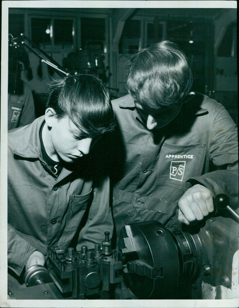 Two apprentices test the alignment on a lathe at the College of Further Education. - Vintage Photograph