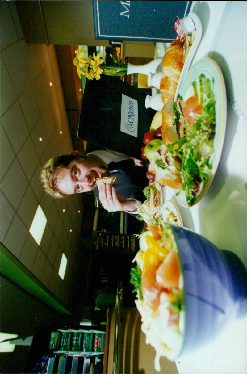 Matthew Weekes enjoys a meal at the new Eurest Sutcliffe staff restaurant in the ACNielsen offices in Oxford. - Vintage Photograph