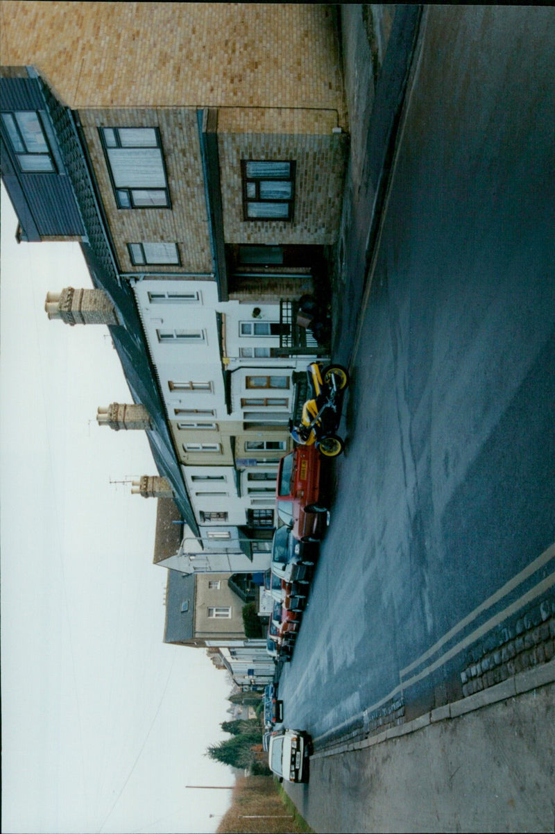 A young drug dealer stands in front of his home in Oxford, England, on January 16, 2001. - Vintage Photograph