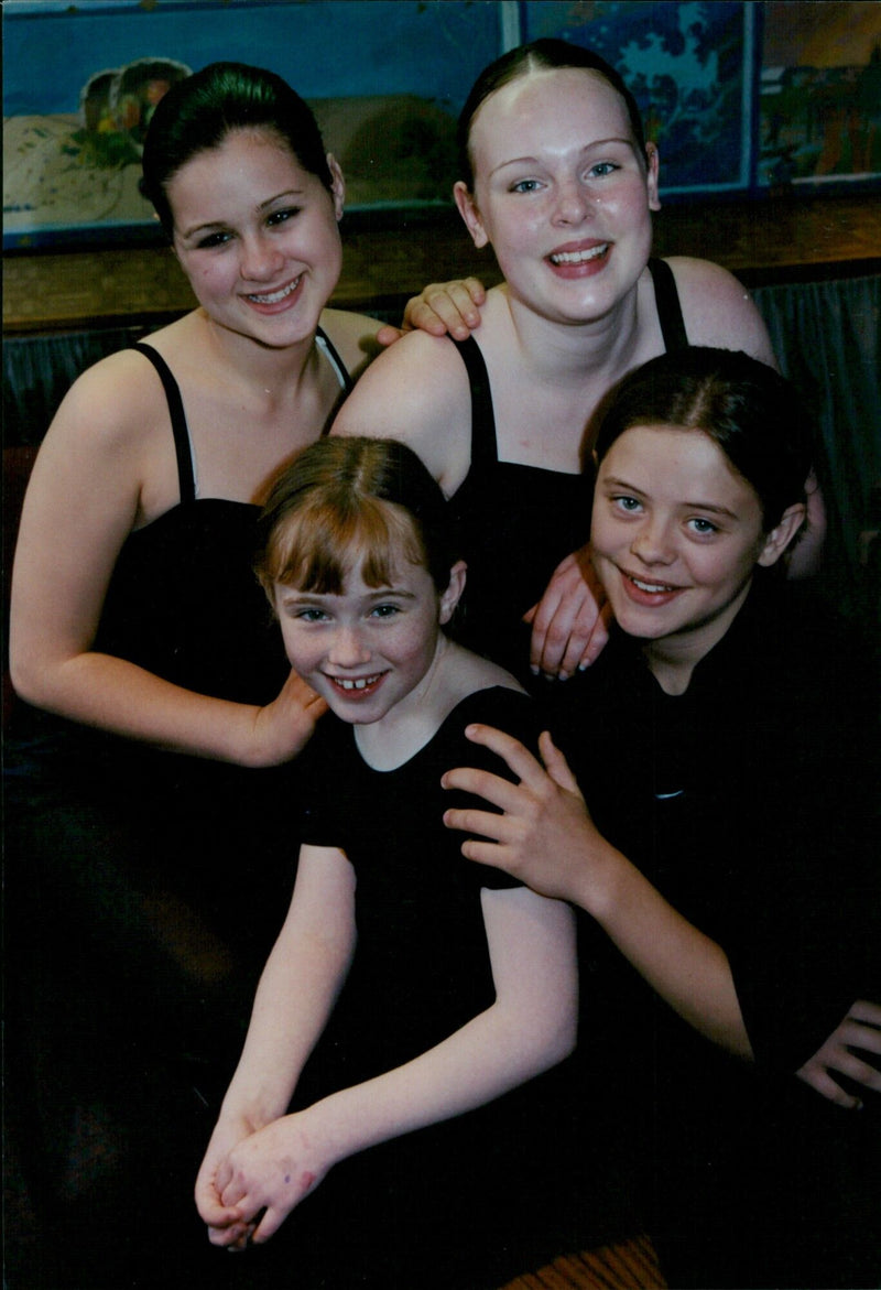 Four young performers from Spotlight Theatre School receive medals for their achievements. - Vintage Photograph