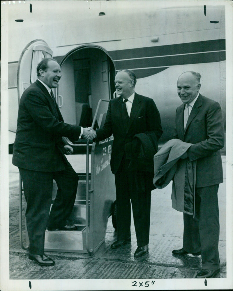 A group of people standing outside of a building in Sienin 2x5, KEB Minister Press. - Vintage Photograph