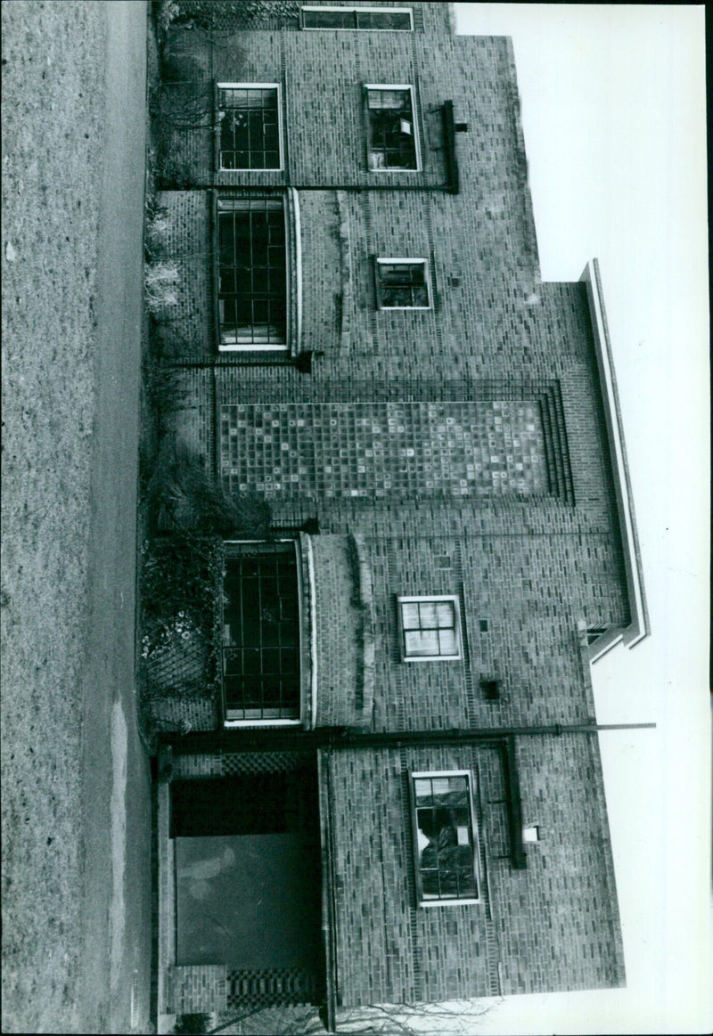 People attending a long-term program to help with drug addiction at a community center in Ley. - Vintage Photograph