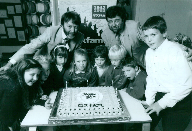 Primary school pupils present a 50th birthday cake to Oxford Oxfam Group representatives at the Beckley Primary School Harvest Festival. - Vintage Photograph