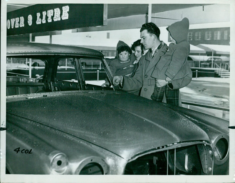 Four-year-old Pameld Phillip (3) with family at the opening of the "products city" for employees' families and friends after the Duke's visit. - Vintage Photograph