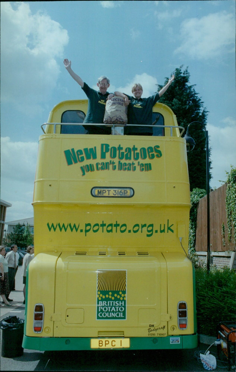 Representatives from the British Potato Council sample new potatoes in Oxford, England. - Vintage Photograph