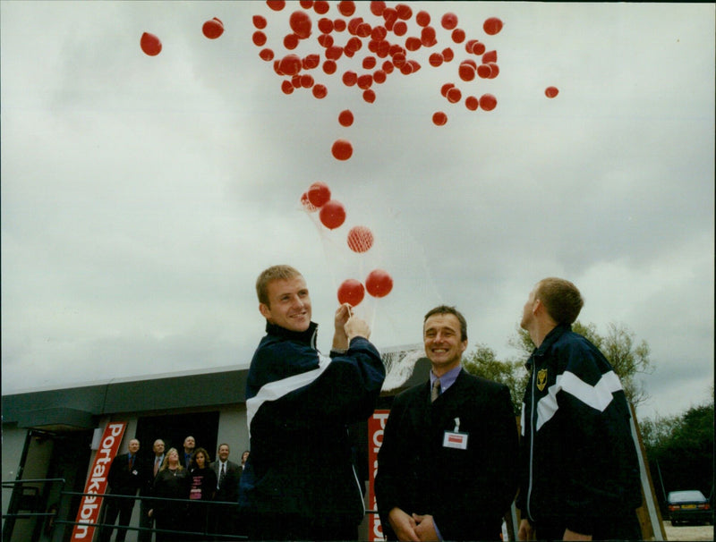 Oxford United players release 200 red balloons to launch Portakabin's new hire centre. - Vintage Photograph