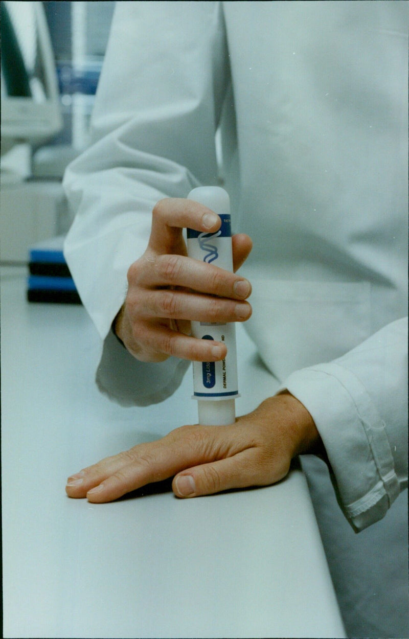 A man posing with a 3mg Lido DERMAL POWD THE 048000 POWERR jock ject propuet firms 25 Hep. - Vintage Photograph